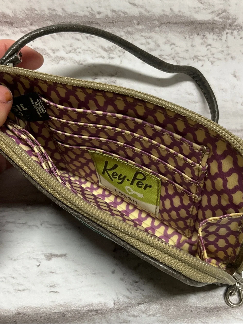 Fossil Black Floral Print Wristlet with Teal Trim